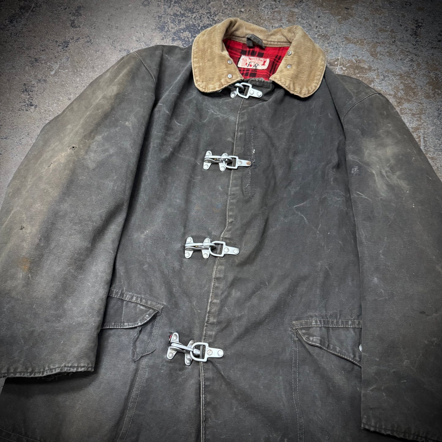 Vintage 1940s Faded Black Distressed and Repaired Fireman’s Clasp Canvas Jacket